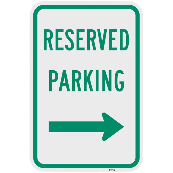 A green parking sign with white text and a right arrow.