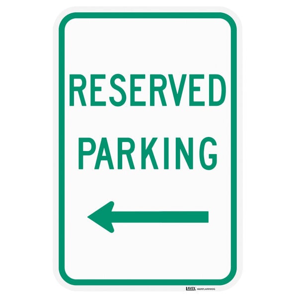 A close-up of a green and white Lavex Reserved Parking sign with a left arrow.