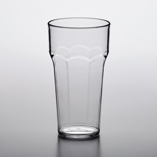 A clear Choice plastic tumbler on a white table.