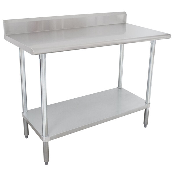 An Advance Tabco stainless steel work table with undershelf.