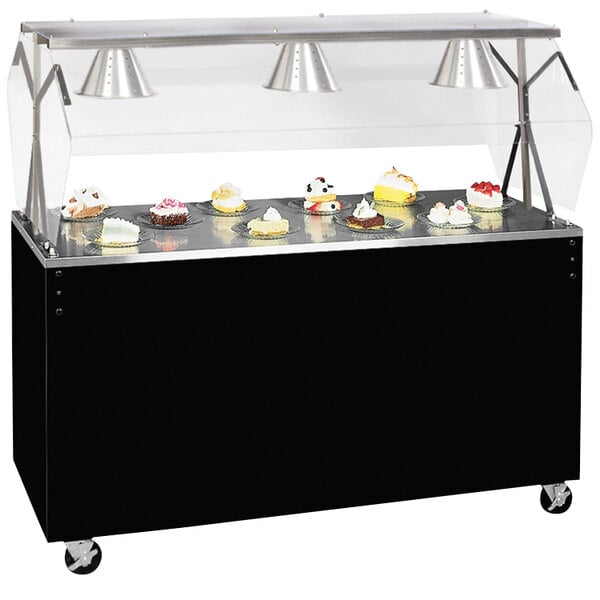 A black and silver food cart with a Vollrath portable buffet on top filled with cupcakes.