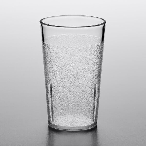 A clear plastic pebbled tumbler.