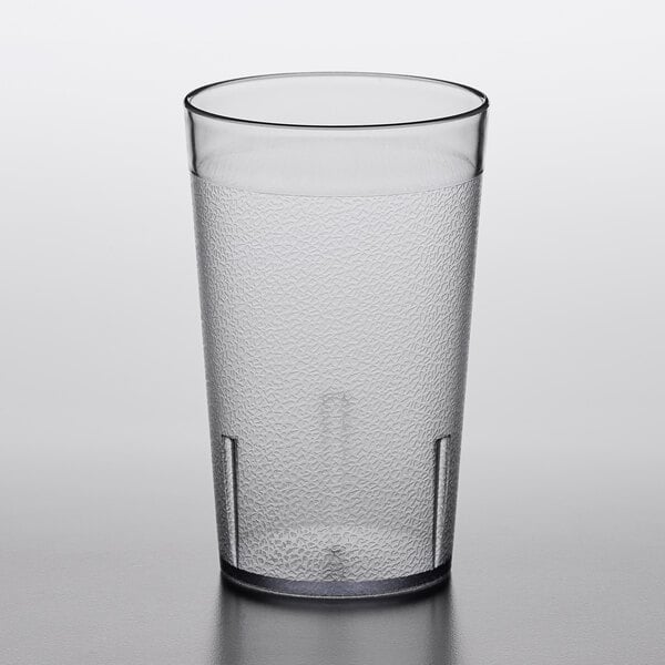 A clear plastic Choice pebbled tumbler on a table.