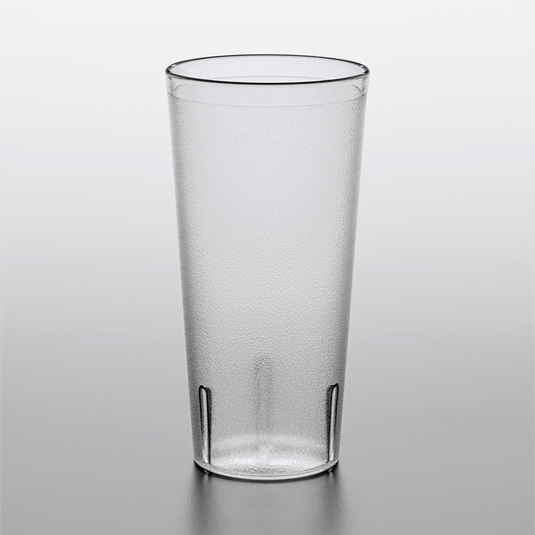 A clear plastic Choice pebbled tumbler on a white surface.
