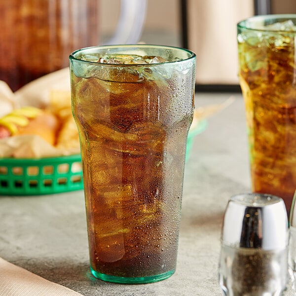 a glass with ice and liquid in it