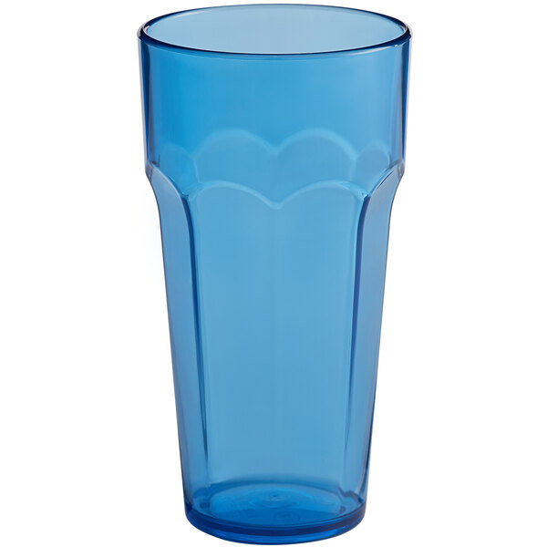 A blue plastic paneled tumbler with a scalloped edge.