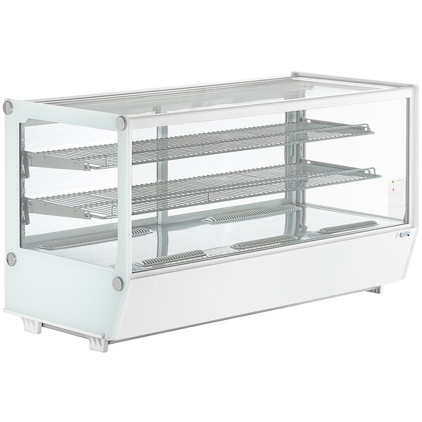 A white Avantco refrigerated countertop display case with glass doors and shelves.