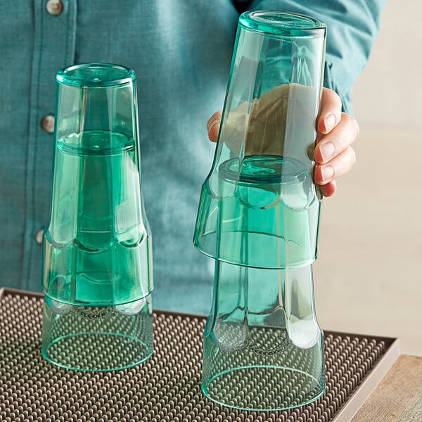 a glass vase on a mat