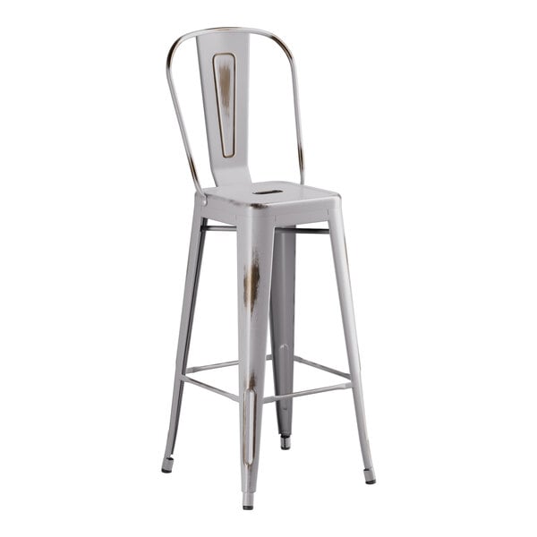 A white metal outdoor cafe barstool with a metal seat.