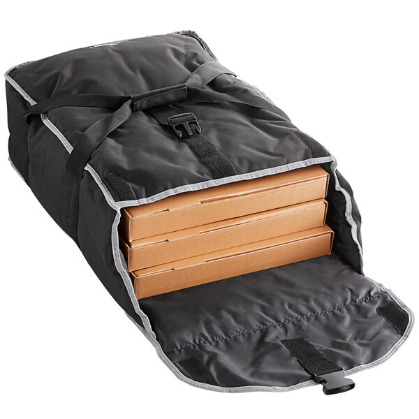 A black Vollrath catering bag holding a stack of cardboard boxes.