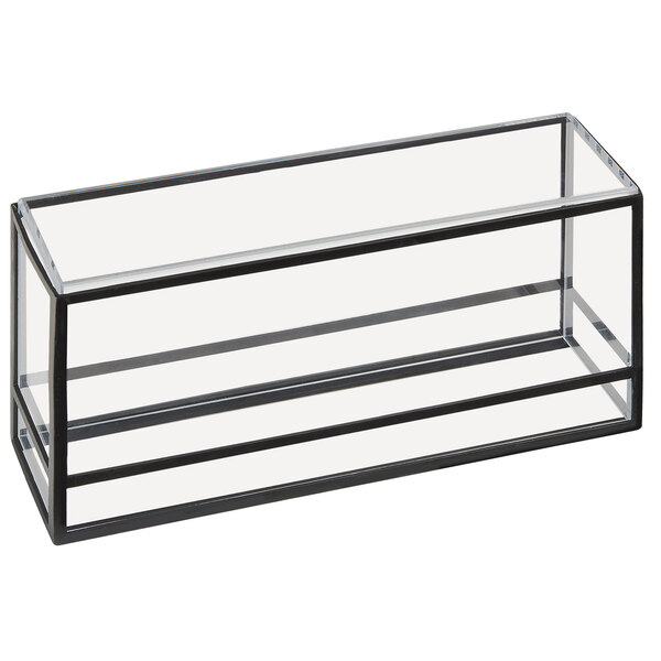 A glass box with a black frame and handles on a counter in a bakery.