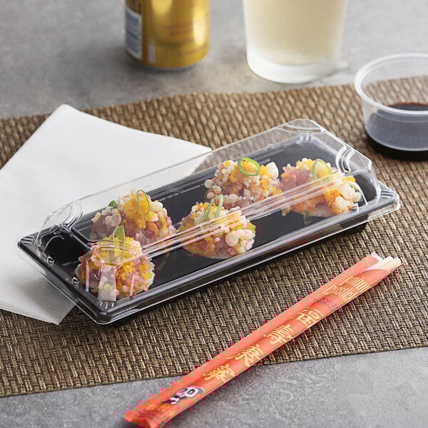 A long, clear plastic food container with a lid, measuring 3 1/2 inches by 8 1/2 inches, shown holding sushi.