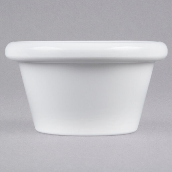 A close up of a white Thunder Group smooth melamine ramekin.
