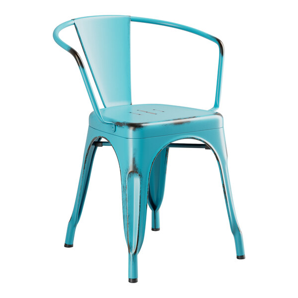A Lancaster Table & Seating distressed turquoise metal arm chair with black legs.