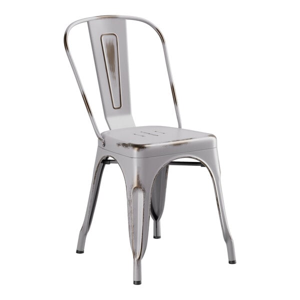 A white metal chair with a brown seat.