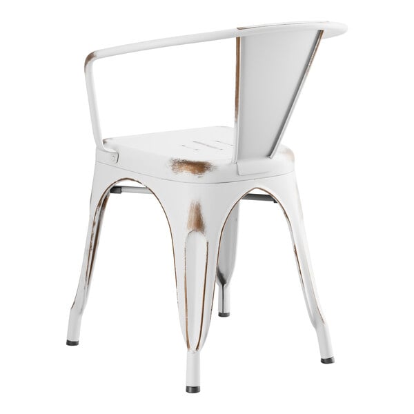 A white metal outdoor arm chair.