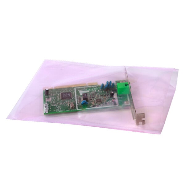 A green circuit board in a clear pink anti-static bag.