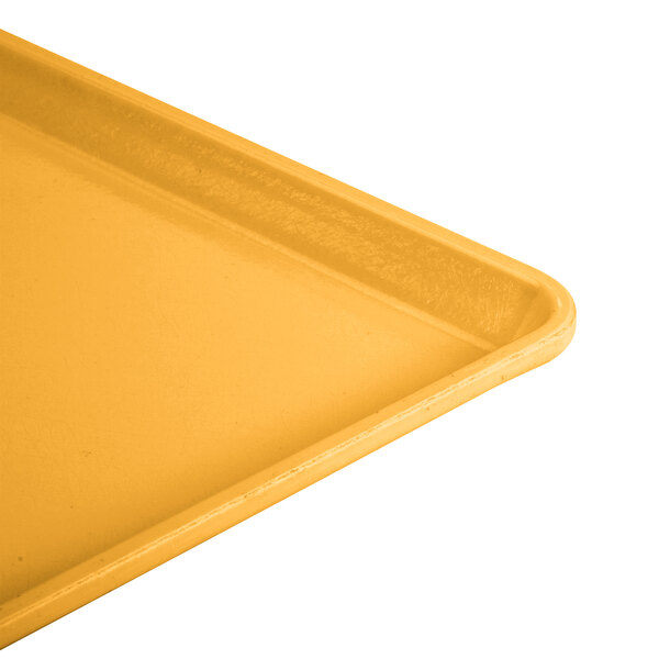 A close up of a yellow Cambro dietary tray.