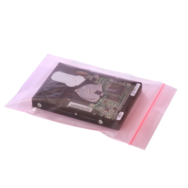 A Lavex pink anti-static bag holding a computer chip.