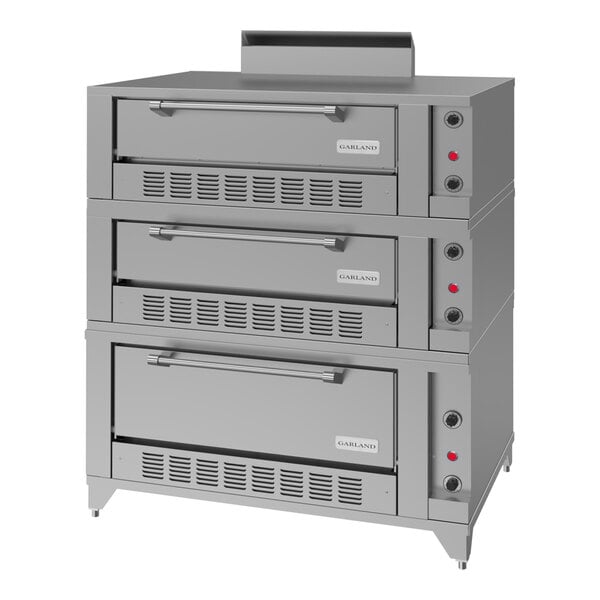 A triple deck stainless steel commercial roast and bake oven designed for natural gas use.