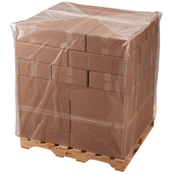 A pallet with a large clear plastic bag on it.