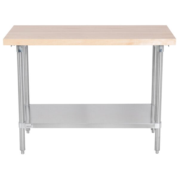 An Advance Tabco wood top work table with a stainless steel base and undershelf.