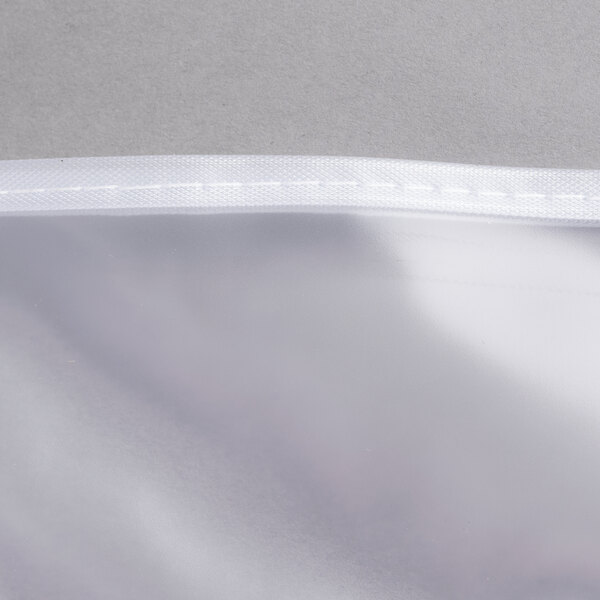 A close-up of a white plastic Cambro Versa food bar cover.