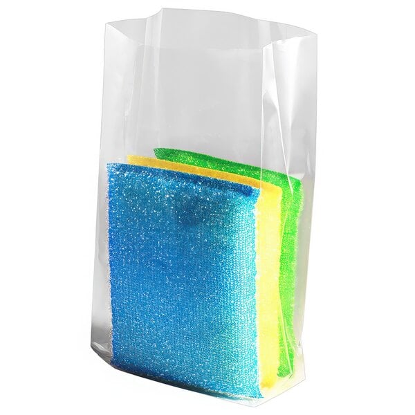 A group of colorful sponges in a clear plastic bag.