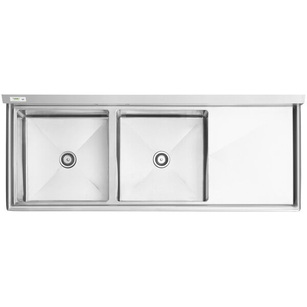 A Regency stainless steel two compartment commercial sink with stainless steel legs and cross bracing with two drainboards.