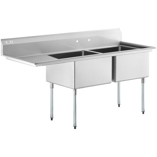 A Regency stainless steel two compartment sink with a left drainboard.