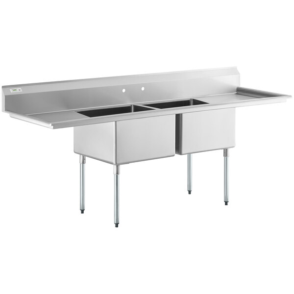 A Regency stainless steel commercial sink with two compartments and drainboards.