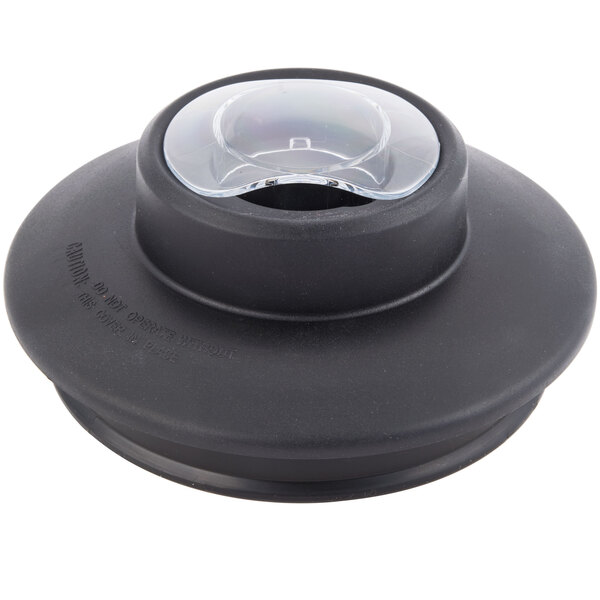 A black plastic lid for a Galaxy 64 oz. jar with a circular hole.