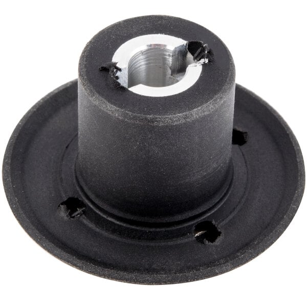 A close-up of a black and silver Galaxy Drive Coupling with a hole in it.