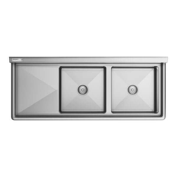 A Regency stainless steel two compartment sink with drainboard.