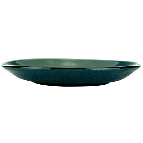 A close-up of a blue International Tableware Luna saucer.