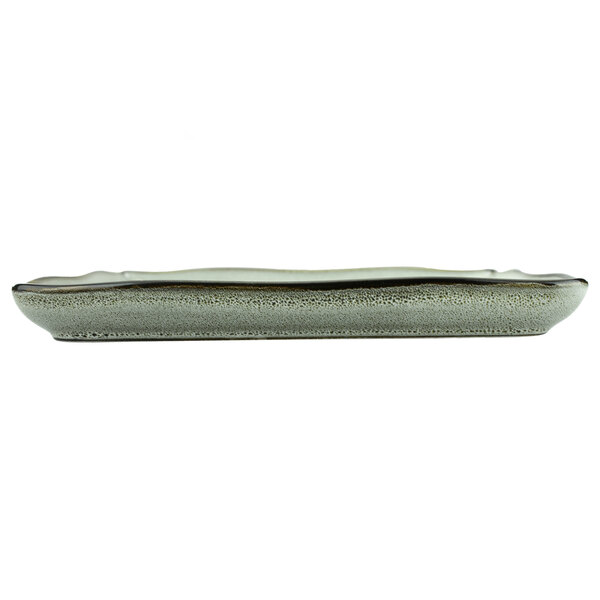 A rectangular porcelain plate with a speckled surface and a gray rim.