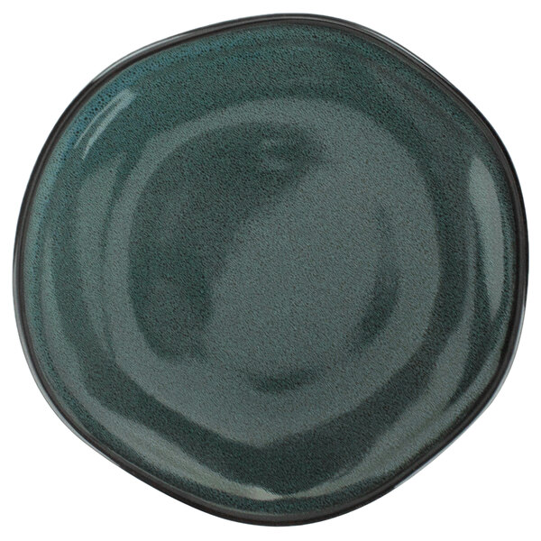 A close up of an International Tableware Luna midnight blue porcelain plate with a black rim.