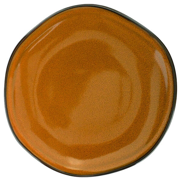 A close-up of a brown International Tableware Luna terracotta porcelain plate with a black rim.