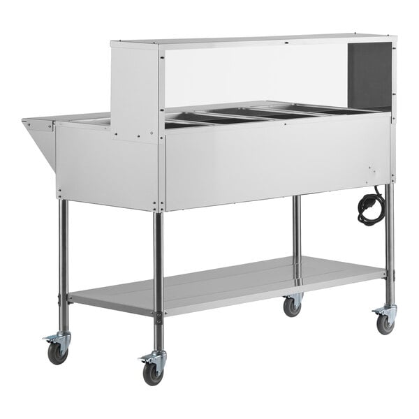 A stainless steel four-pan open well mobile electric steam table with an undershelf, overshelf, sneeze guard, and caster wheels.