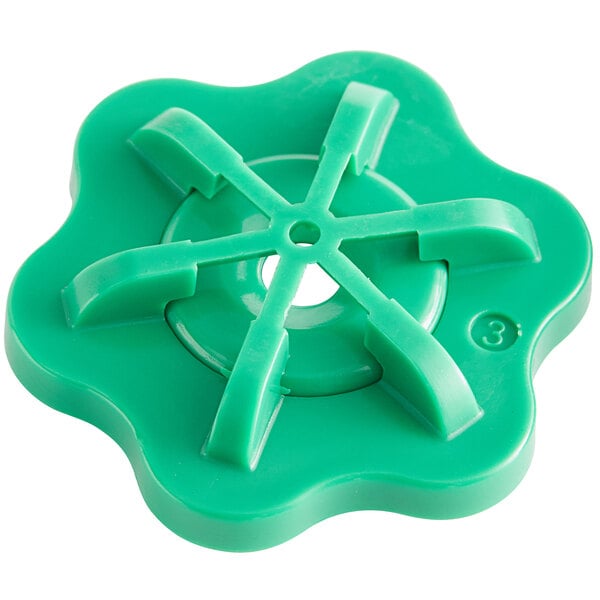 A green plastic flower shaped sprayhead with seven holes.