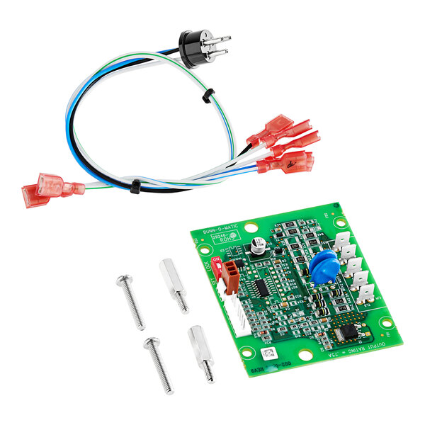 A green circuit board with wires and screws.