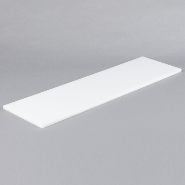 A white rectangular Avantco cutting board.