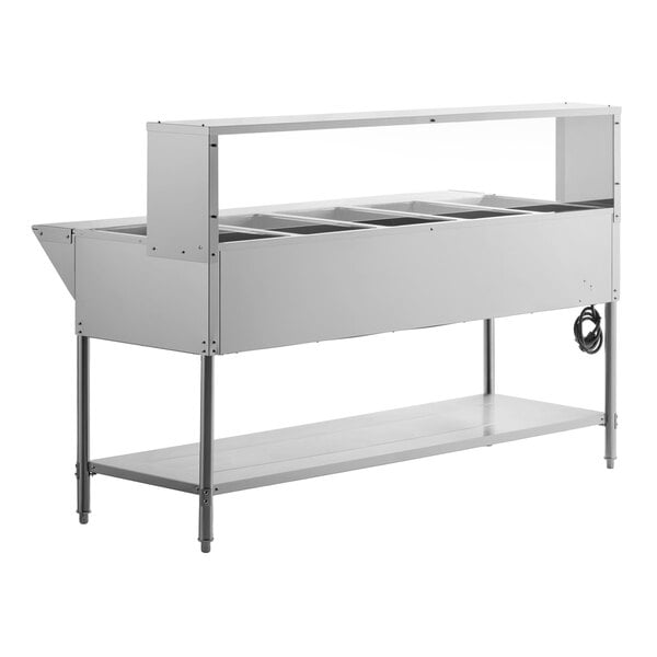 A five pan open well electric steam table with an undershelf, overshelf, and sneeze guard.