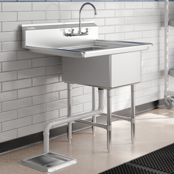 A Regency stainless steel one compartment sink with a left drainboard.