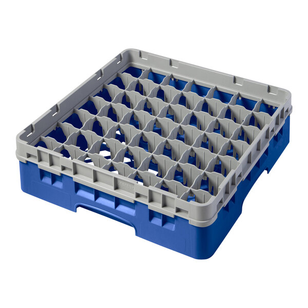 A blue plastic Cambro glass rack with compartments.