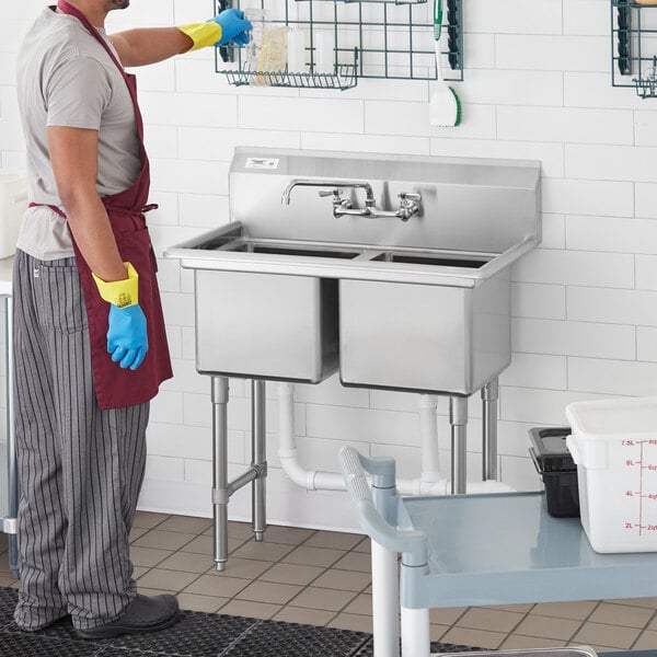 a stainless steel sink with a faucet