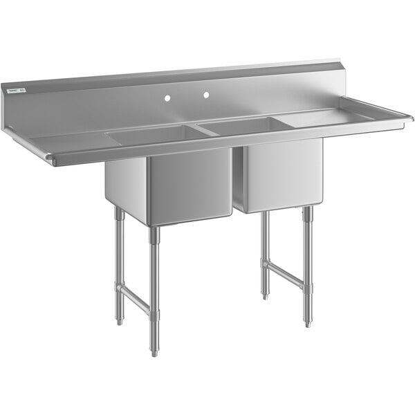 A Regency stainless steel two compartment sink with stainless steel legs and cross bracing with two drainboards.
