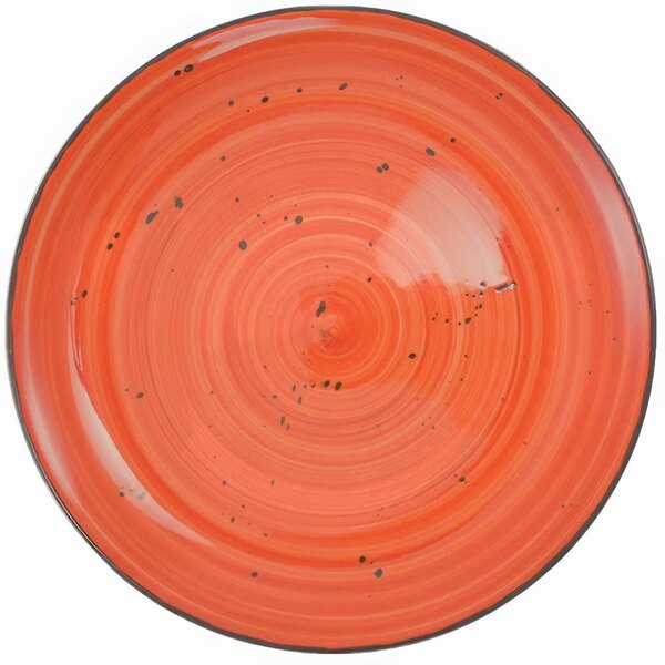 A red porcelain pasta bowl with black specks.