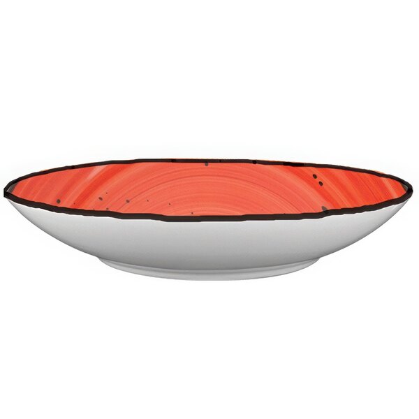 A white porcelain pasta bowl with a red rim.