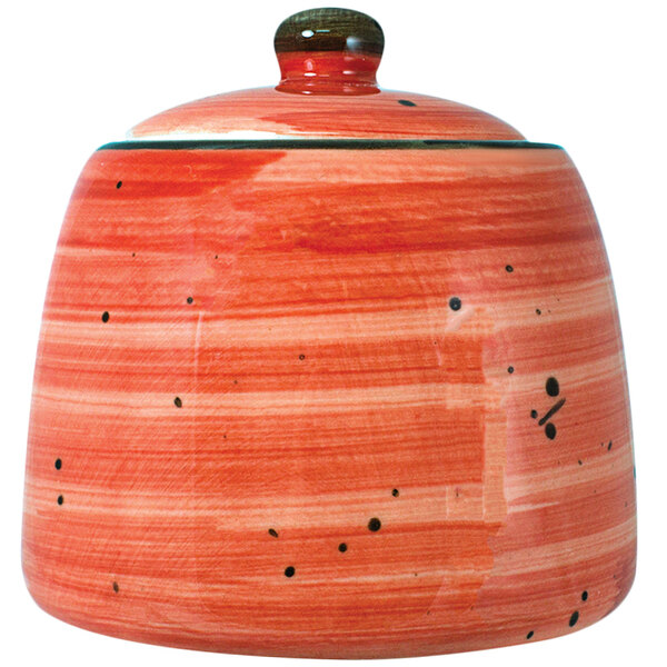 An International Tableware ruby red porcelain sugar dish with a lid and handle.